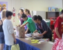 Teen volunteers working as cashiers in the Children\'s Room 