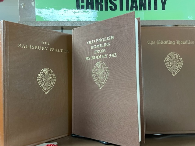 Pictured volumes are Early English Text Society editions of The Salisbury Psalters, Old English Homilies from MS Bodley 343, and The Blickling Homilies