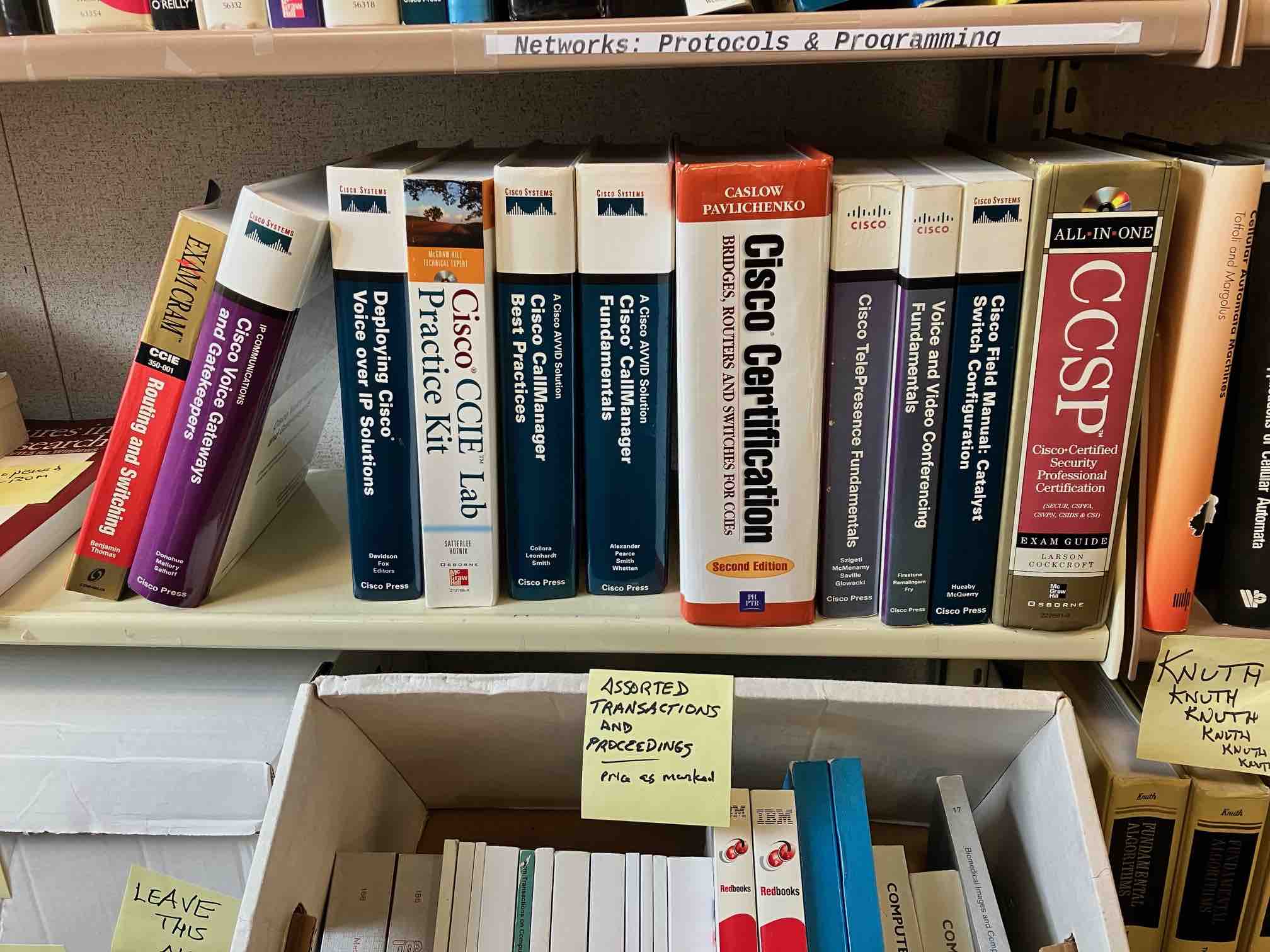 Detail photo of Cisco exam prep books and scholarly publications box