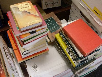 three piles of books